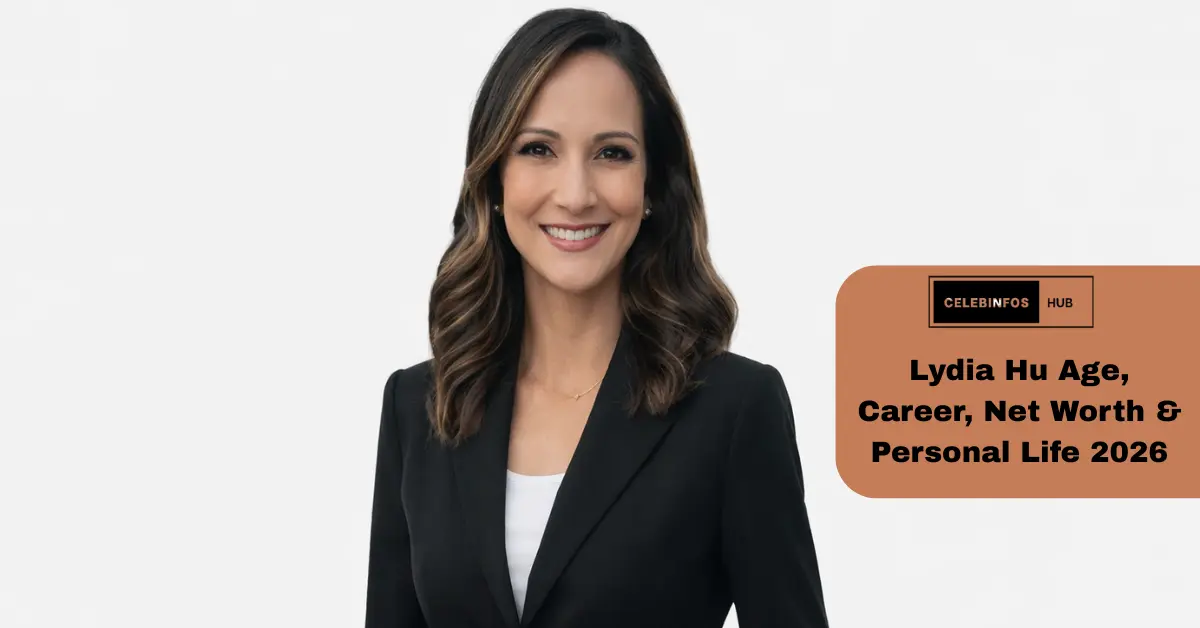 Lydia Hu, dressed in a suit and tie, stands in front of a white background, showcasing her professional demeanor and confidence.