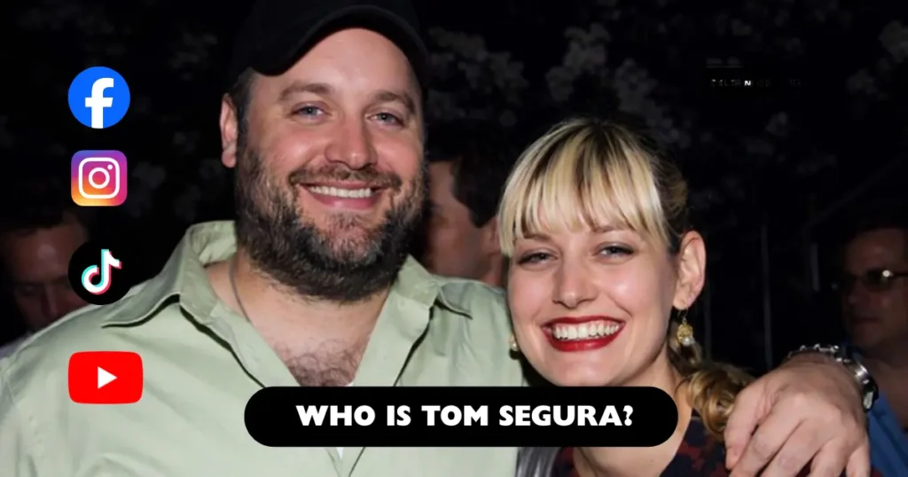 Smiling couple posing together at a nighttime event, with the man wearing a cap and light green shirt and the woman smiling brightly beside him.
Image related to Tom Segura net worth, showing a casual public appearance with a close companion.